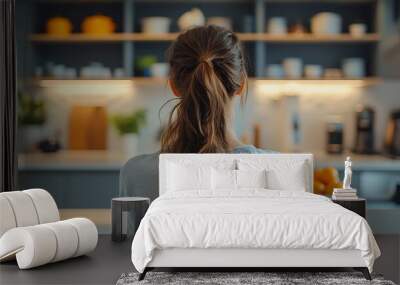 Back view of young woman standing near white counters in modern kitchen : Generative AI Wall mural