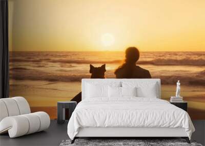 Couple sitting on the beach and watching the sunset. Man and woman sitting on the beach with their dog.generative ai Wall mural