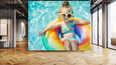 Cute funny toddler girl in colorful swimsuit and sunglasses relaxing on inflatable toy ring floating in pool have fun during summer vacation in tropical resort Child having fun in swim : Generative AI Wall mural