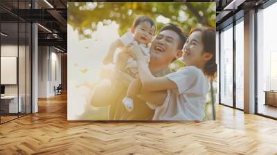 Happy Asian family parent and little kids enjoy and fun outdoor lifestyle on summer holiday vacation Father mother and child playing and resting together at park Family relationship co : Generative AI Wall mural