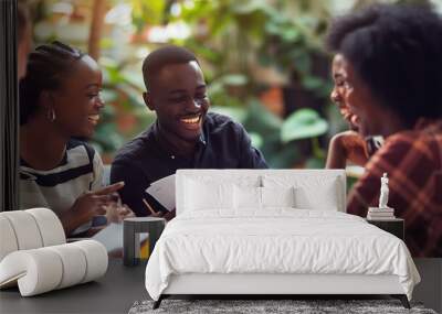 Laughing group of a young African businesspeople going over paperwork together during a casual meeting over coffee in an office : Generative AI Wall mural