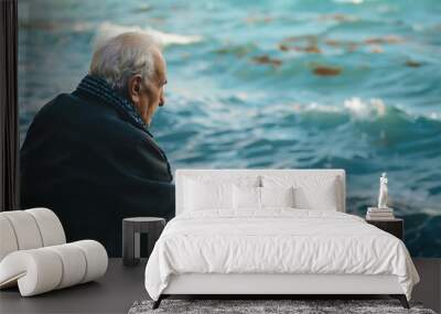 Sad old man sitting by the sea Concept about people sadness and loneliness : Generative AI Wall mural