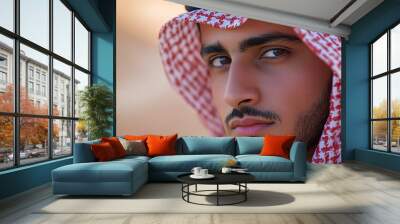 Young khaleeji man wearing keffiyeh  dreams in desert Visit Saudi Arabia concept AlUla and Hegra tours : Generative AI Wall mural