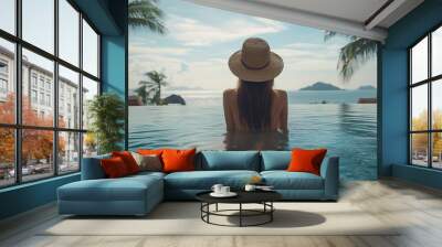 Young woman traveler relaxing and enjoying the beach view by a tropical resort pool while traveling for summer vacation Travel lifestyle concept : Generative AI Wall mural