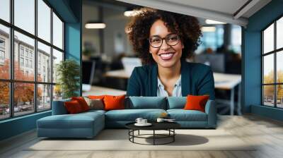 Beautiful black african american woman working in the office smiling Wall mural