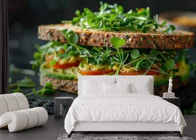 Realistic image of a sandwich filled with avocado and microgreens, emphasizing their use in culinary creations Wall mural