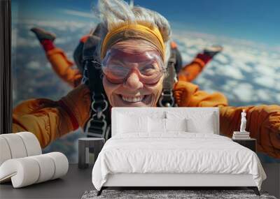 Experience the exhilaration of a senior woman skydiving against a stunning blue sky backdrop. Embrace freedom and carefree living. Wall mural