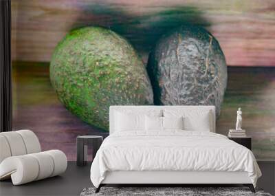 Avocados on a wood background Wall mural