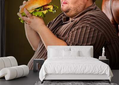 Diet failure of fat man eating fast food hamberger. Breakfast for overweight person who spoiled healthy food by eating huge hamburger. Junk meal leads to obesity. Use of harmful products. Wall mural