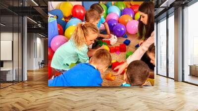 Group children game blocks on floor . Wall mural