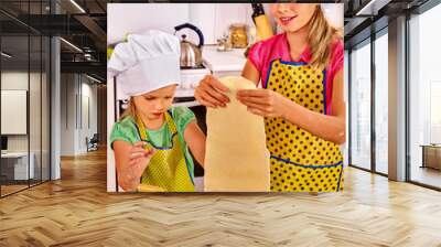 Mother and child making homemade pasta. Wall mural