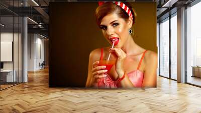 Pin up girl drink bloody Mary cocktail. Pin-up retro meeting woman wearing red dress flirt with men. Wall mural