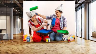 Repair home women holding bank with paint for wallpaper. Elderly mother and daughter renovation apartment on isolated. Home renovation. Good relations of mother and adult daughter. Wall mural