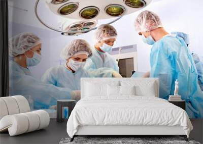 Surgeon at work in operating room. Wall mural