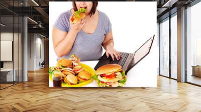 Woman eating junk food. Wall mural