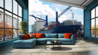 Container ship with own cranes make loading and discharging of reefer containers at the Brazilian port. Wall mural