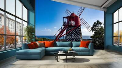 Windmill on Pico Island. Azores. Pico Island sightseeing. Atlantic Ocean coast. Beautiful landscape panoramic view.  Wall mural