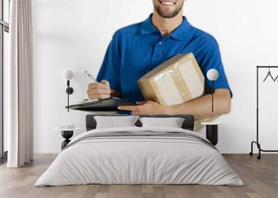 Young handsome courier guy with boxed parcel and clipboard Wall mural