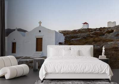 a small chapel on top oh the mountain and two windmills on the background at amorgos island Wall mural