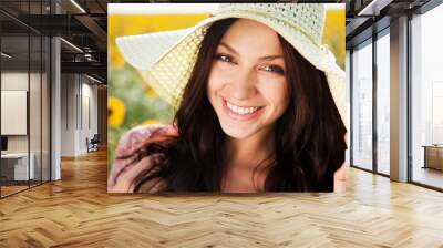 Beautiful lady in sunflower field Wall mural