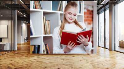 Teenage girl in a library Wall mural