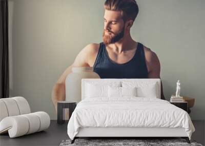 Man with sport nutrition Wall mural