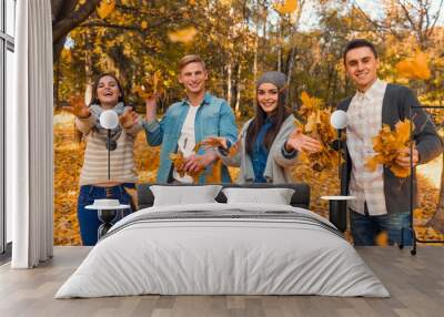 Students in autumn park Wall mural