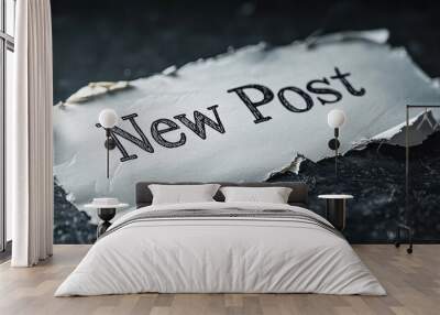 A piece of white paper with the words 'New Post' displayed prominently, resting on a textured dark background Wall mural