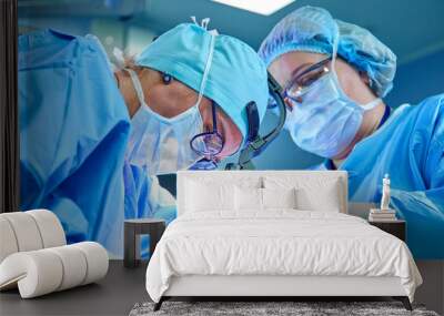 A surgeon's team in uniform performs an operation on a patient at a cardiac surgery clinic. Modern medicine, a professional team of surgeons, health. Wall mural