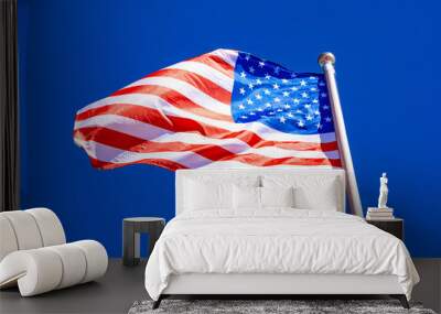 American Flag against blue sky. Wall mural