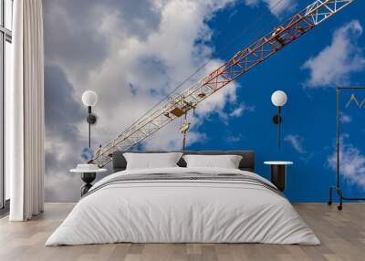 Construction site with cranes with blue sky Wall mural