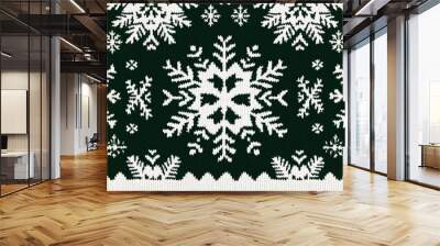 Festive Christmas sweater pattern with intricate white snowflakes and ornaments on dark green fabric background Wall mural