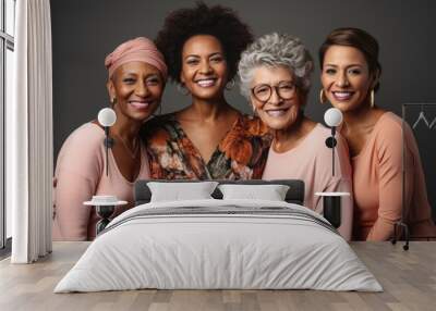 Half-length portrait of four cheerful senior diverse multiethnic women. Female friends smiling at camera while posing together. Diversity, beauty, friendship concept. Isolated over grey background. Wall mural