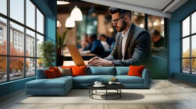 man working on laptop in office  Wall mural