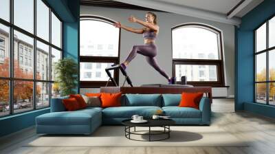 Modern equipment Cadilac reformer for Pilates in the gym, Concept of health and rehabilitation, instructor performs exercises on the reformer to correct the musculoskeletal system. Wall mural