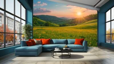 Picturesque colorful summer landscape with warm sunset lighting. A meadow with yellow wildflowers in the foreground, forested hills and evening sky in the background. Wall mural