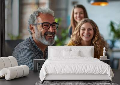 Two happy middle-aged people smiling at work in a modern office setting Wall mural