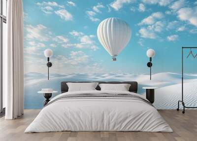 White hot air balloon soaring over a vast expanse of pristine white sand dunes under a bright blue sky with scattered clouds Wall mural