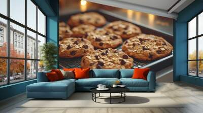 A freshly baked vegan cookies on a tray, with ingredients like oats and dark chocolate Wall mural