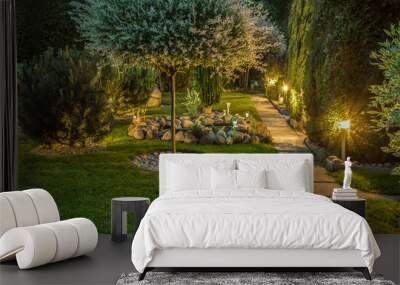 Garden illuminated by lamps Wall mural