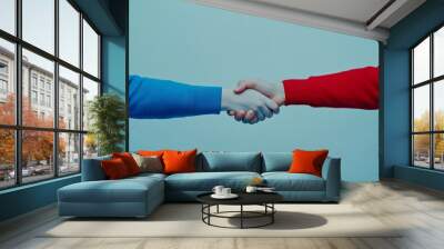 Handshake between person in blue and person in red Wall mural