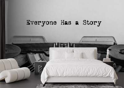 Everyone has a story printed on a vintage typewriter. Wall mural