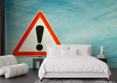 Exclamation point of attention against the sky. triangular sign. Danger, warning. Wall mural