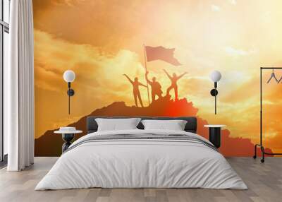 High achiever, silhouettes of three people holding on top of a mountain to raise their hands up. A man on top of a mountain. Conceptual design. Against a dramatic sky with clouds at sunset. Wall mural