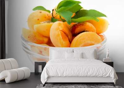 apricot halves with leaves in a transparent plate on a white bac Wall mural