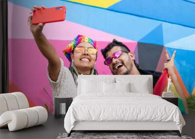 Happy and proud: A couple showing their support for the LGBTQ community taking a selfie Wall mural