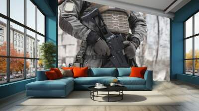 A military man with a machine gun is on duty. Wall mural