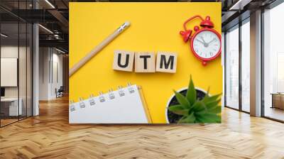 Modern marketing buzzword UTM - Urchin tracking module. Top view on wooden table with blocks. Top view. Wall mural