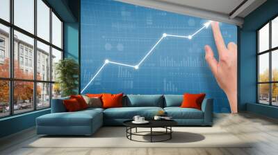 Person points to growth graph on graphical display Wall mural