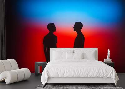 silhouettes of two people facing each other against colorful sky Wall mural